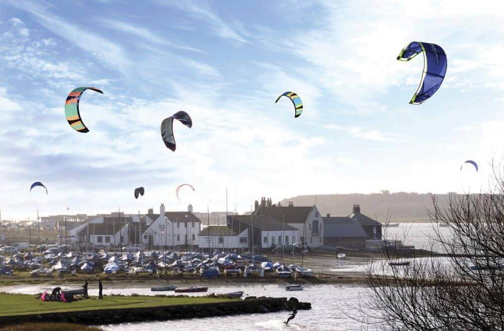 kites flying at christchurch harbour uk dorset